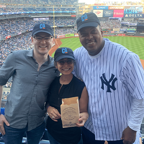 young man, older woman with NY Yankees baseball player