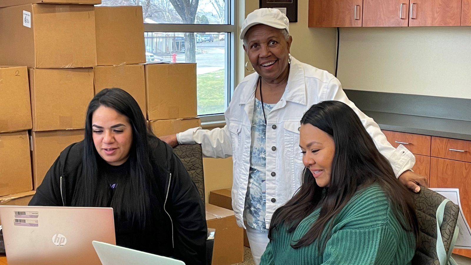 Photo caption: Generations Serving Together, Fresno working together to develop lesson plans for the young adults at Fresno EOC LCC YouthBuild Charter School.