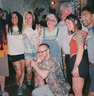 An intergenerational group posing for a photo